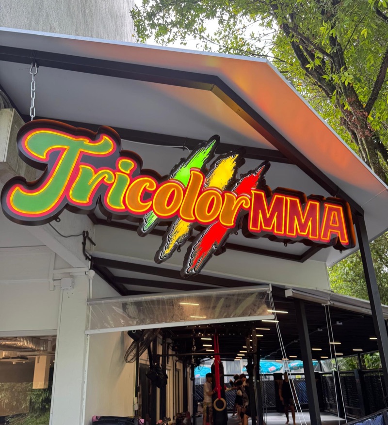 Tricolor MMA sign above the entrance at 78 Rifle Range Road.